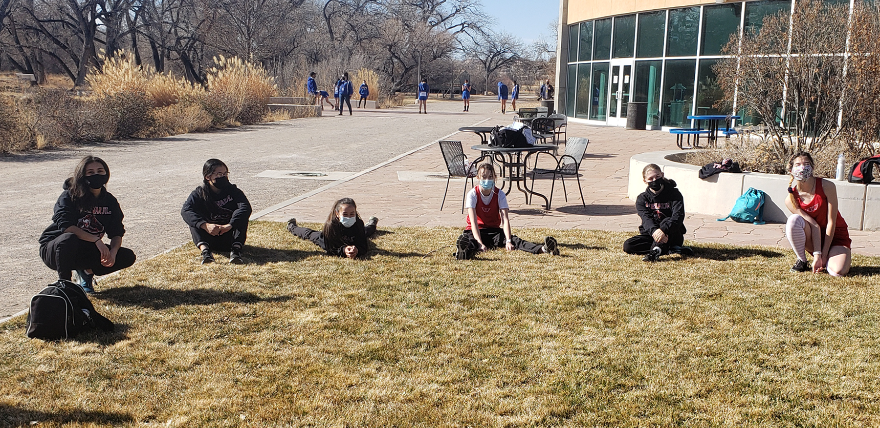 The Menaul girls cross country team prepares for its reace at the Bosque Invitational on Saturday, February 27, 2021.