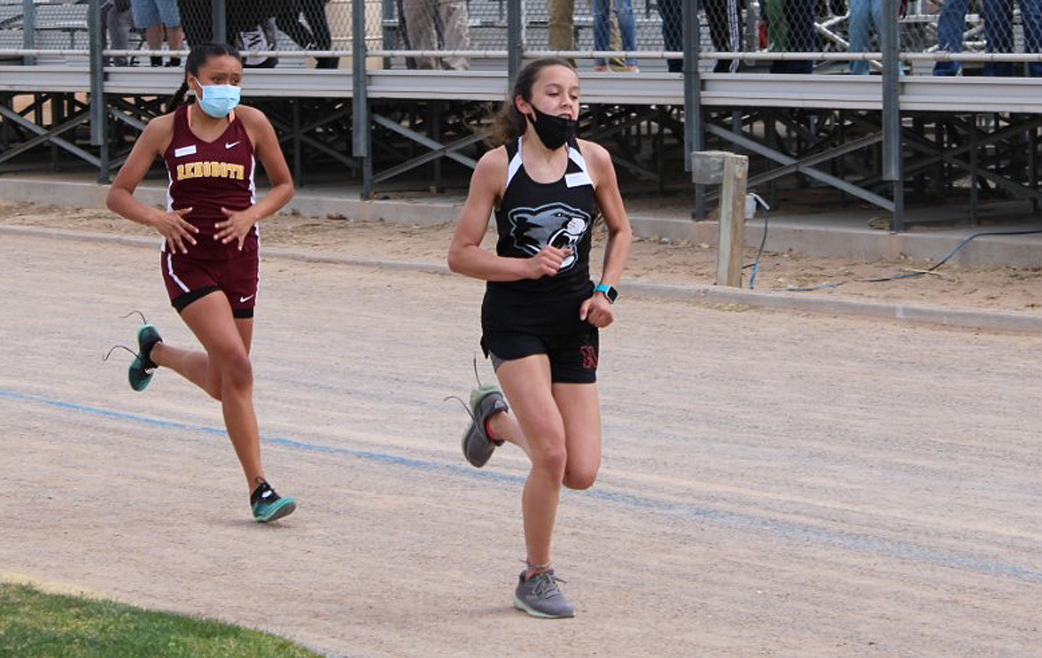 Panther Cross Country runner Charli B. tries to hold off a competitor in the St. Pius Cross Country trials on Saturday, March 13. Charli finished in second with a time of 22:37.